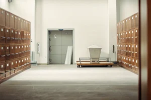 Organized cremation supplies in a professional crematory workspace