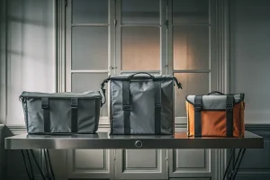 Heavy-duty body bags in various sizes with reinforced handles designed for secure transport.
