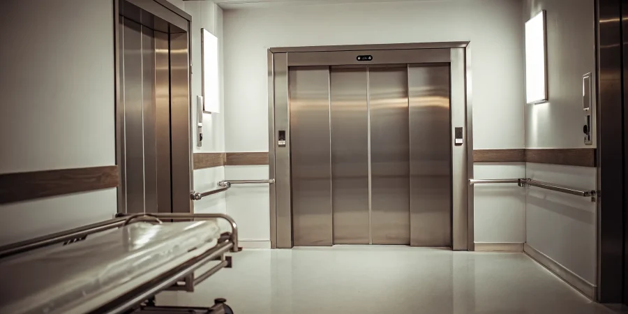 Heavy-duty stainless steel mortuary body lift in a clean preparation room