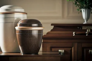 Burial urn vault beside a cremation urn