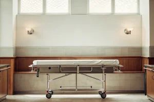 Professional mortuary removal cot in funeral home prep room